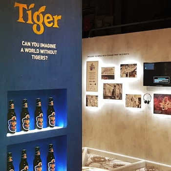 Bridging Design and Conservation: Tiger Awareness Exhibition in Singapore. Studio Königshausen showcases the brand's innovative approach—using thermochromic ink on limited edition cans to make the iconic tiger reappear when chilled.